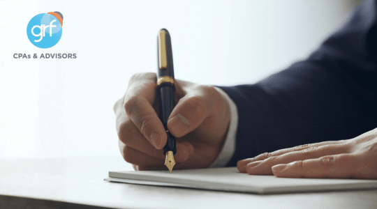 DEI executive order - closeup of hand signing a document